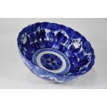 A 19th century Japanese blue and white floriform punch bowl