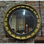 A 19th century giltwood framed circular bevel edged mirror