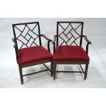 A companion pair of Chippendale design elbow chairs