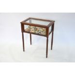 A cross banded mahogany vitrine table