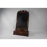 A mahogany platform toilet mirror, 19th century