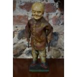 A vintage papier-mache Chinese/Manchu figure on stand