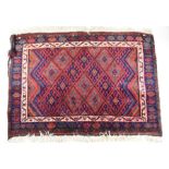 A Persian Afshar rug and a small red ground Kurdish rug (2)
