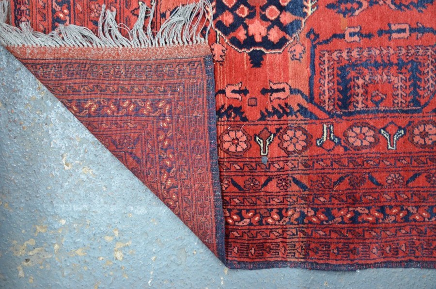 An old Afghan carpet - Image 2 of 4