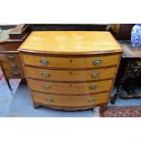 A George III bowfront cross-banded satinwood chest of four long graduated drawers