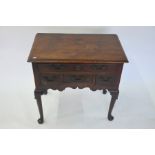 An 18th century oak lowboy with an arrangement of drawers