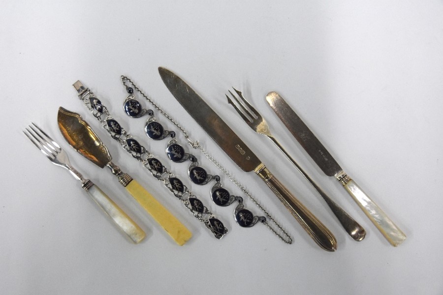 Silver cutlery and Siamese jewellery