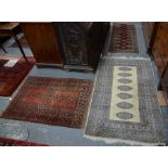 Two small red ground rugs