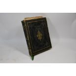 A Victorian embossed leather album containing a selection of paintings