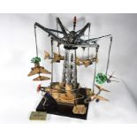 A Meccano carousel hung with six aircraft