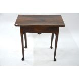 An early 18th century oak single drawer side table