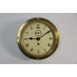 An old brass cased 8-day bulkhead clock