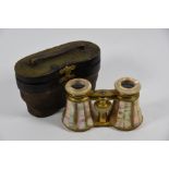 A pair of 19th century gilt brass and mother of pearl opera glasses in leather case