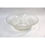 A large cut glass bowl with hobnail and milled edge designs