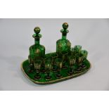 A 19th century green and gilt glass liqueur set
