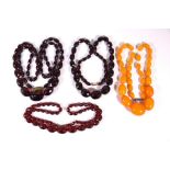 Three cherry red amber necklaces and another