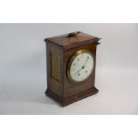 An antique walnut cased table clock