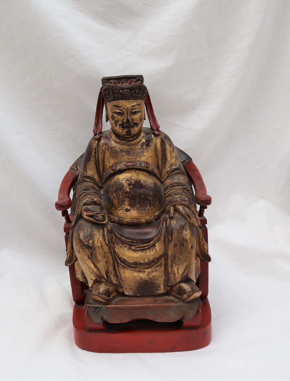 A Chinese carved, gilt and red painted figure of a seated dignitary, - Image 4 of 15