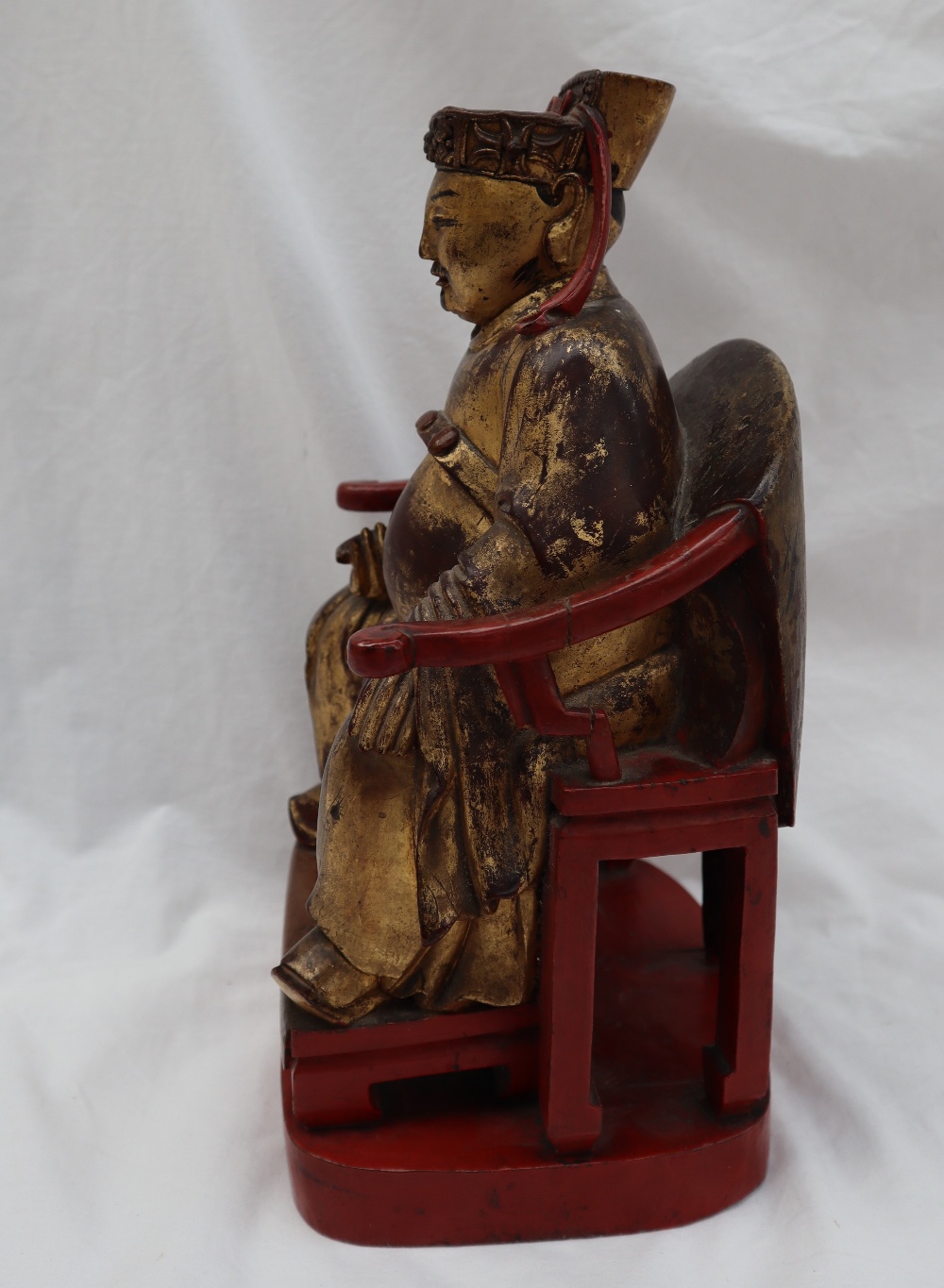 A Chinese carved, gilt and red painted figure of a seated dignitary, - Image 6 of 15