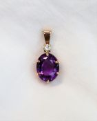 An amethyst and diamond pendant, the oval faceted amethyst 16 x 12mm,