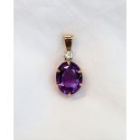 An amethyst and diamond pendant, the oval faceted amethyst 16 x 12mm,