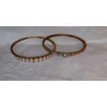 Two 9ct yellow gold semi precious gem set hinged bangles, approximately 16.