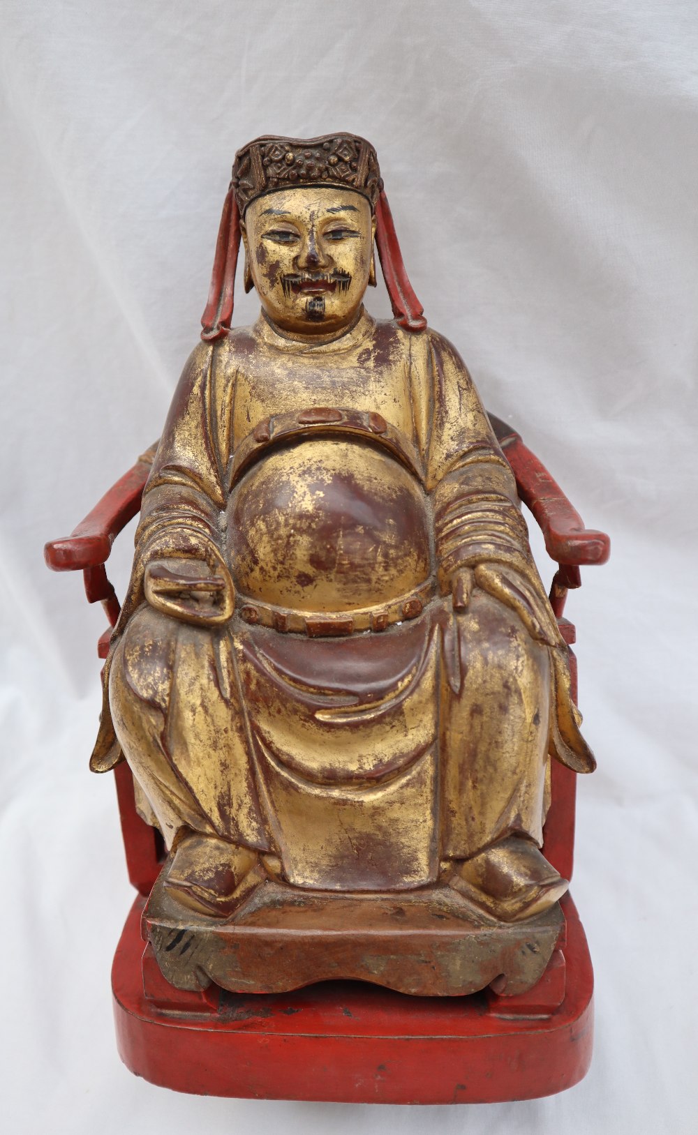 A Chinese carved, gilt and red painted figure of a seated dignitary, - Image 5 of 15