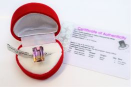 An Anahi Ametrine and yellow diamond ring, the central Ametrine measuring 14 x 10mm,