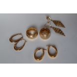 Two 9ct yellow gold wedding bands together with three pairs of 9ct gold earrings, approximately 19.