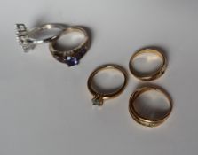 Three 9ct yellow gold semi precious set dress rings together with two silver rings