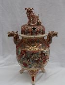 A Japanese satsuma pottery pot pourri vase and cover, with a seated lion dog terminal,