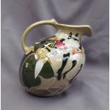 A Moorcroft pottery jug, decorated in the "Pigalle" pattern,