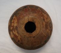 A 19th century shaped wooden bowl, painted with bands of iron red and black, possibly for opium,