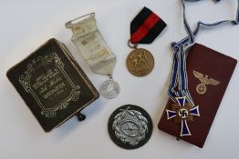 A Third Reich Mothers cross, with blue and white enamel,