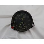 A Russian Aviators flight duration meter, the black dial with two subsidiary dials,