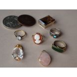 A shell cameo ring, together with other rings,