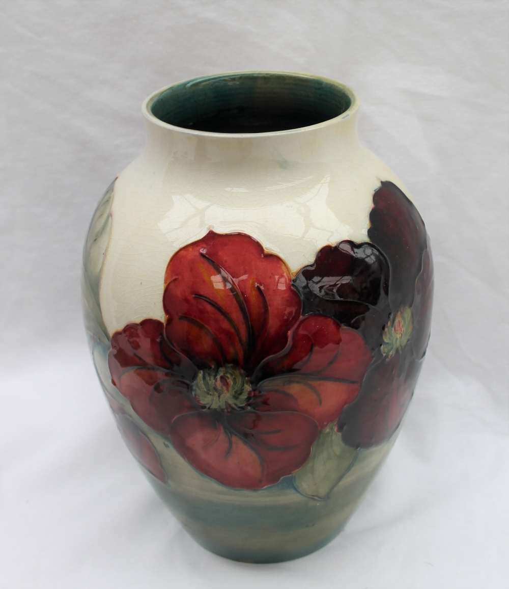 A Moorcroft Clematis pattern vase with a tapering neck to a cream ground, impressed mark, - Image 4 of 7