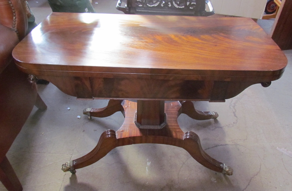 A Regency mahogany card table with a rectangular fold over top with a baize interior on a tapering - Image 2 of 7