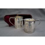 A George IV silver christening mug, of tapering baluster form with line decoration, London, 1823,