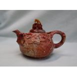 A Chinese carved soapstone teapot, the lid decorated with an eagle,