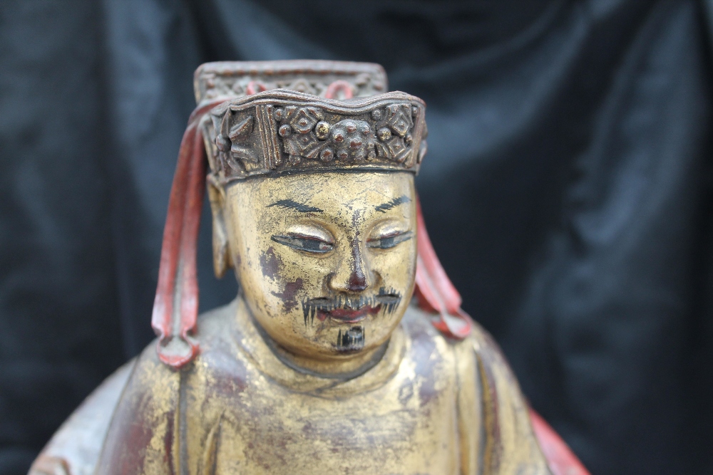 A Chinese carved, gilt and red painted figure of a seated dignitary, - Image 8 of 15