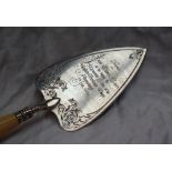 A Victorian silver trowel engravedwith scrolling leaves,