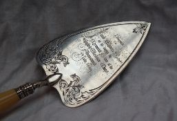 A Victorian silver trowel engravedwith scrolling leaves,