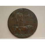 A World War I "Dead man's penny" or Memorial plaque issued to "Herbert Ernest Hutton"