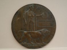 A World War I "Dead man's penny" or Memorial plaque issued to "Herbert Ernest Hutton"