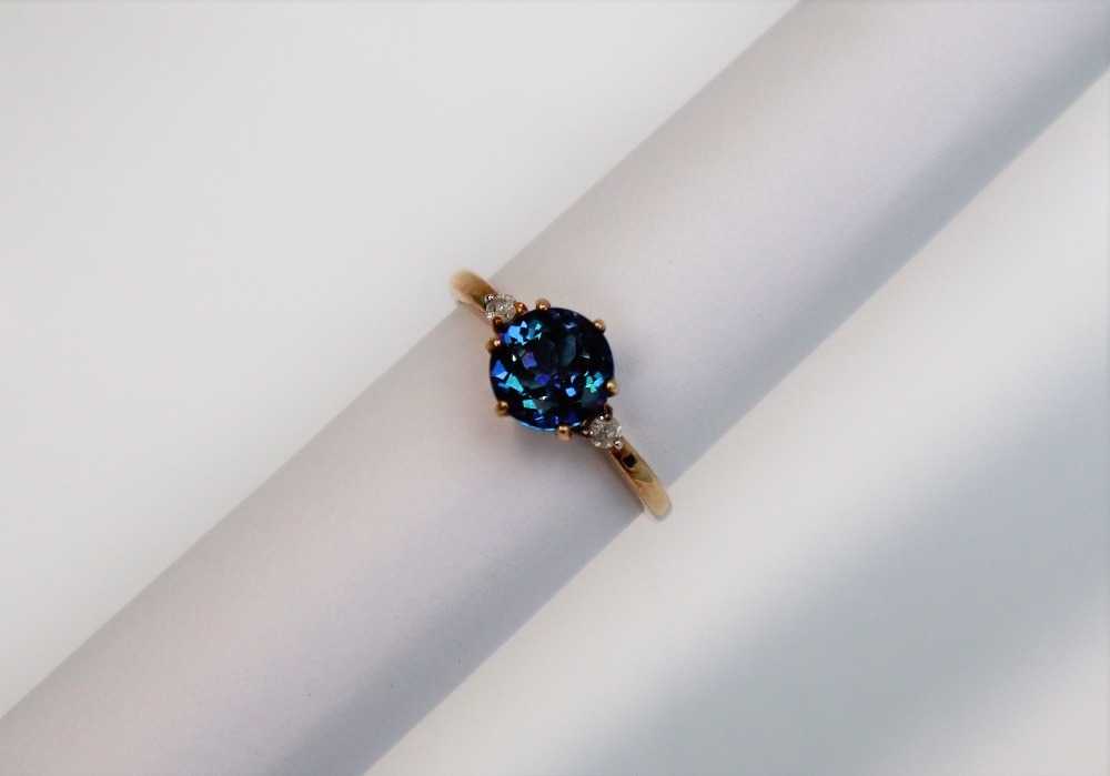 A topaz and diamond ring, the central round faceted topaz, 7mm in diameter, - Image 2 of 4