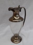 A George V silver topped and tapering cylindrical glass claret jug,