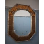 A Murano glass mirror, of octagonal form, with a floral mounted rope twist border and flower heads,