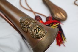 A copper shot flask with ribbed decoration J.W.