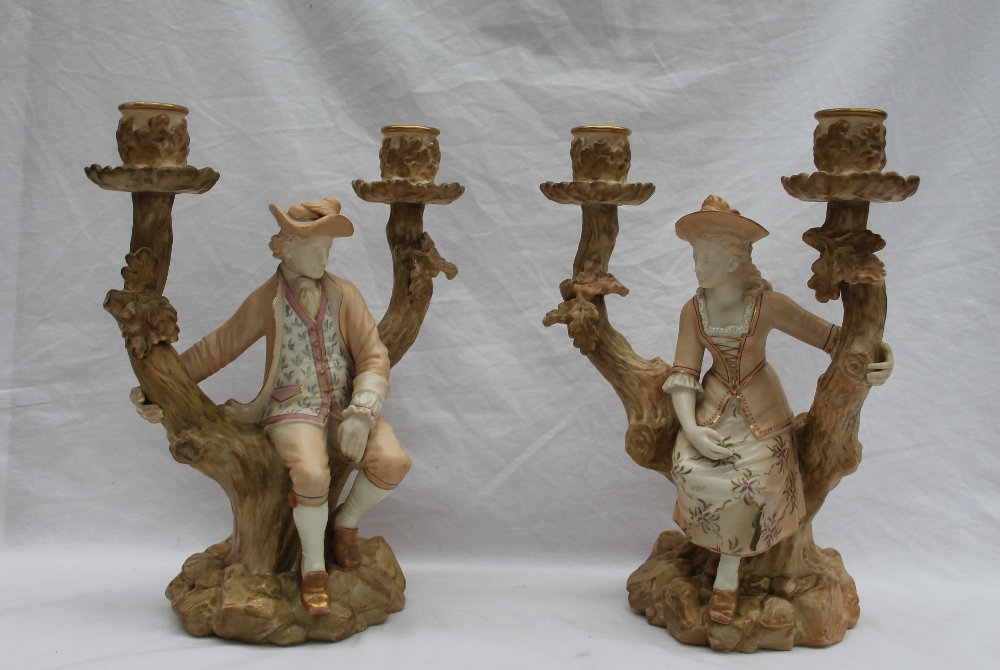 A pair of Royal Worcester Watteau style figural candelabra,